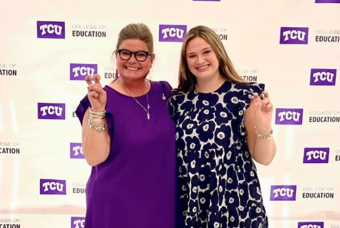 mother stephanie plotner and daughter ella plotner smiling holding horned frog hand signs