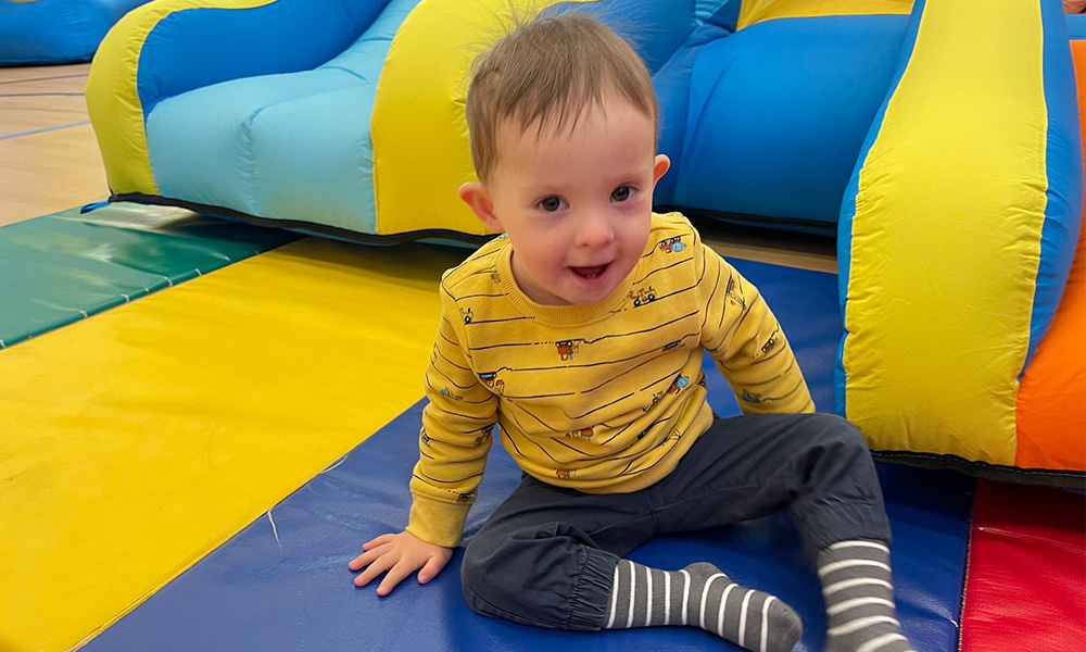 boy playing on slide