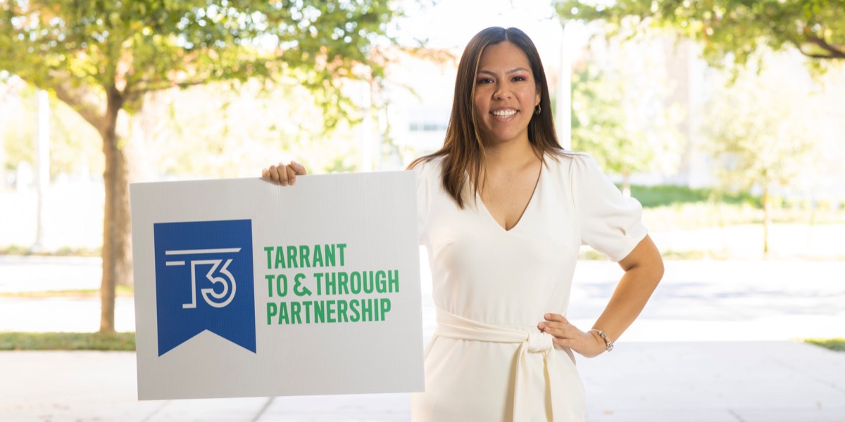 TCU CAC Senior Adviser Valerie Gonzalez holds up a Tarrant To & Through sign