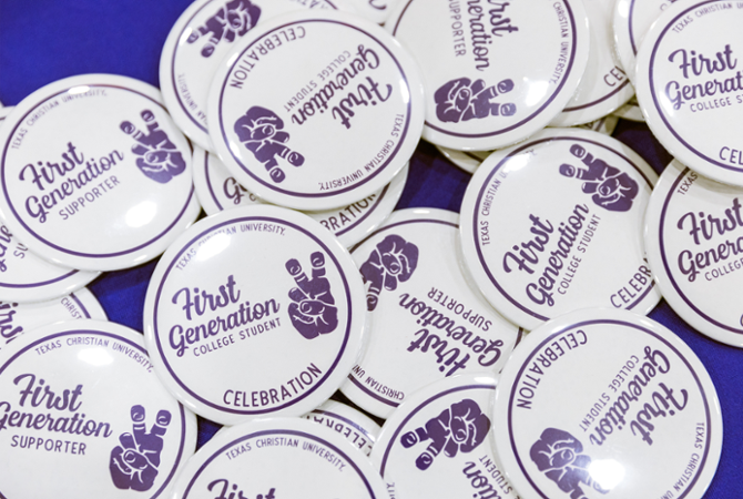 first generation college student stickers on table with "horned frogs" hand sign