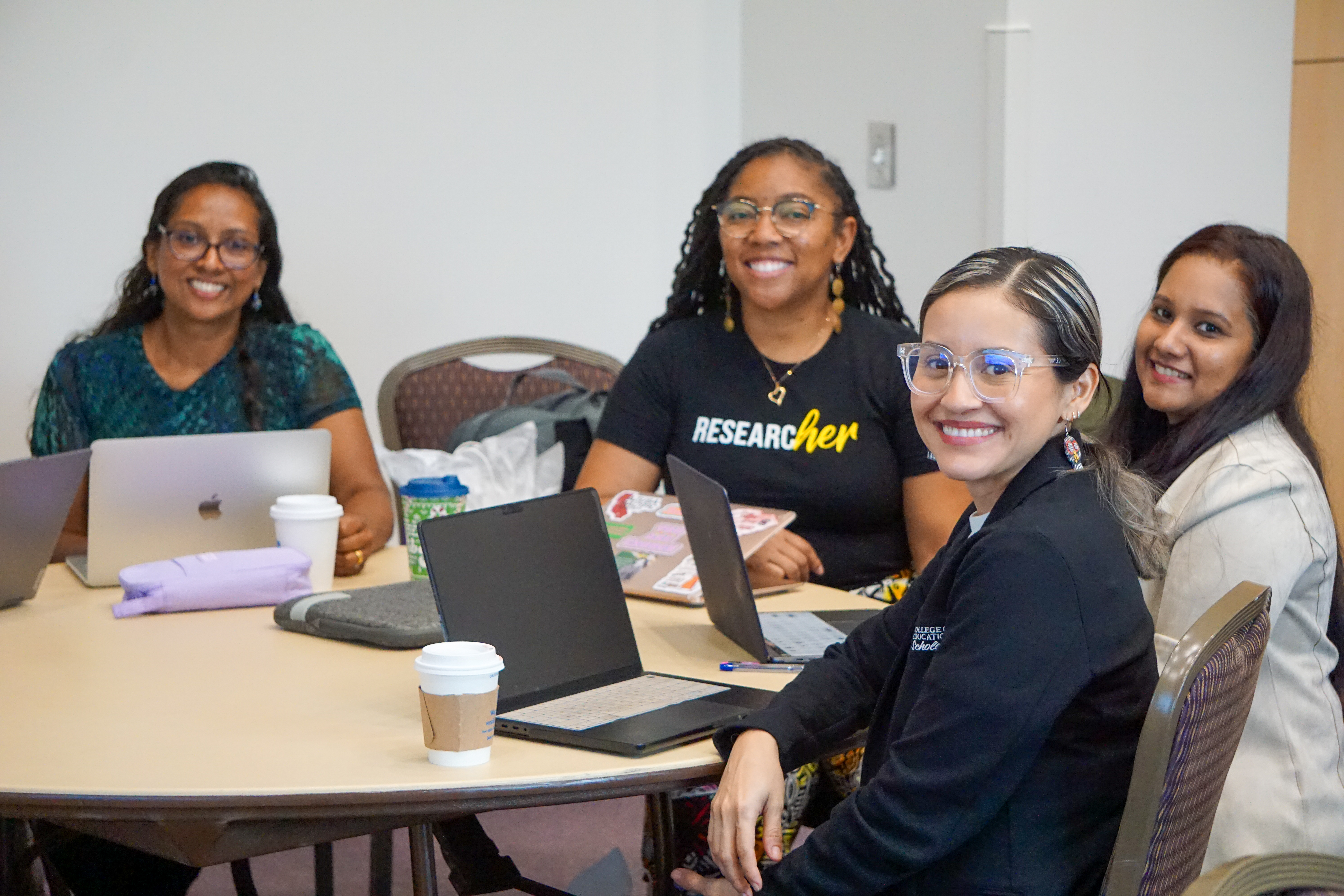 four women smiling