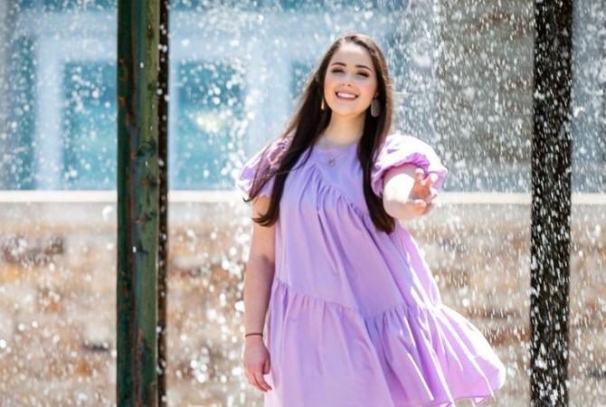 kaylee skinner smiling in purple dress with 